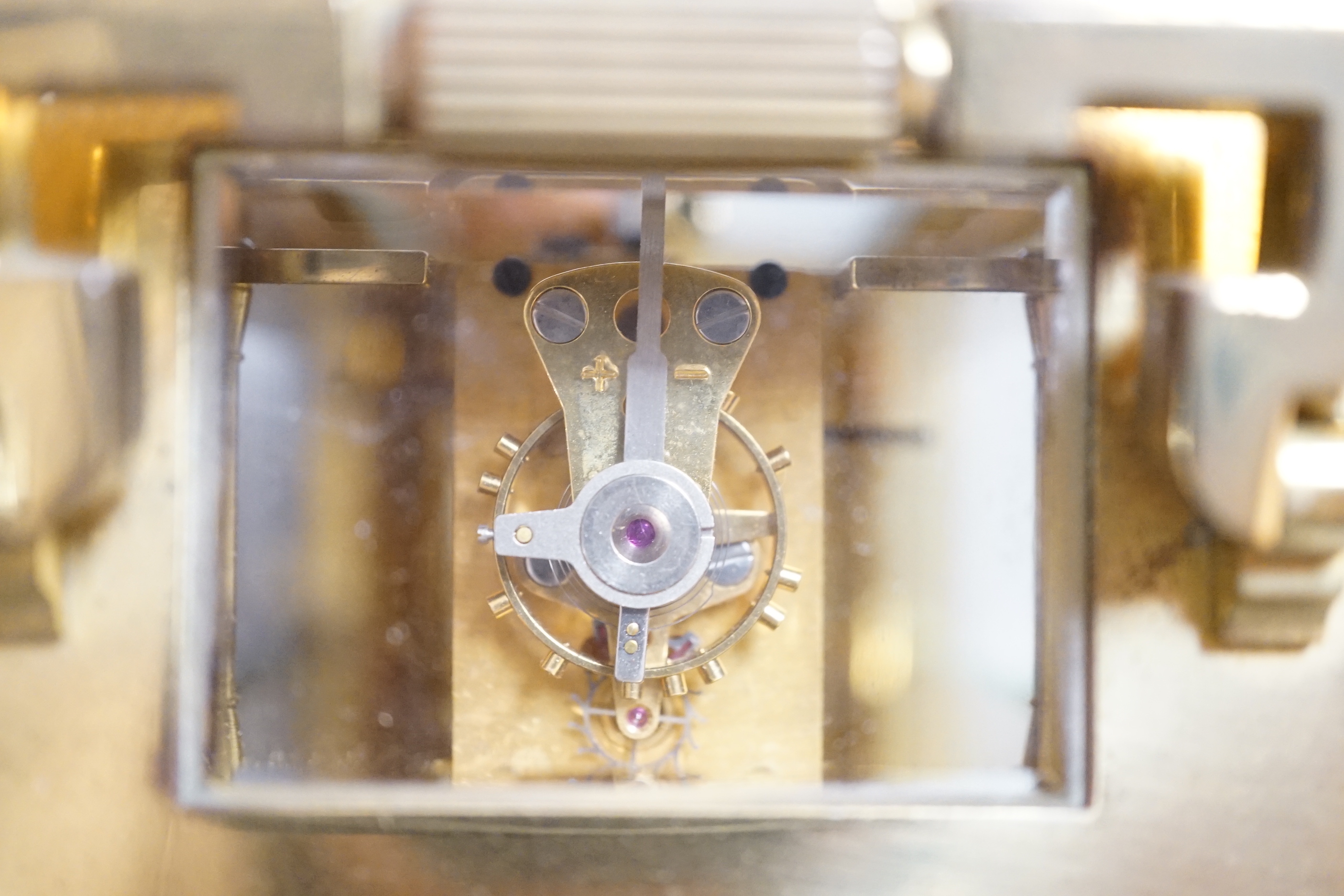 A brass mantel timepiece, retailed by Mappin and Webb, 13cm